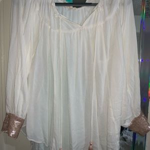 boutique top with sequin sleeves